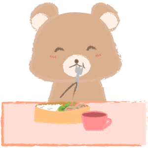 お弁当を食べる子クマ