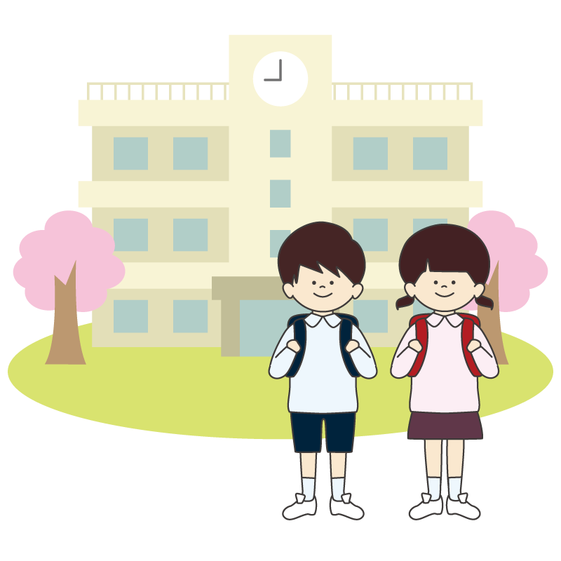 桜の咲く小学校の前で立つ新入生